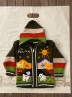 Suéter tipo cárdigan tejido a mano para niños