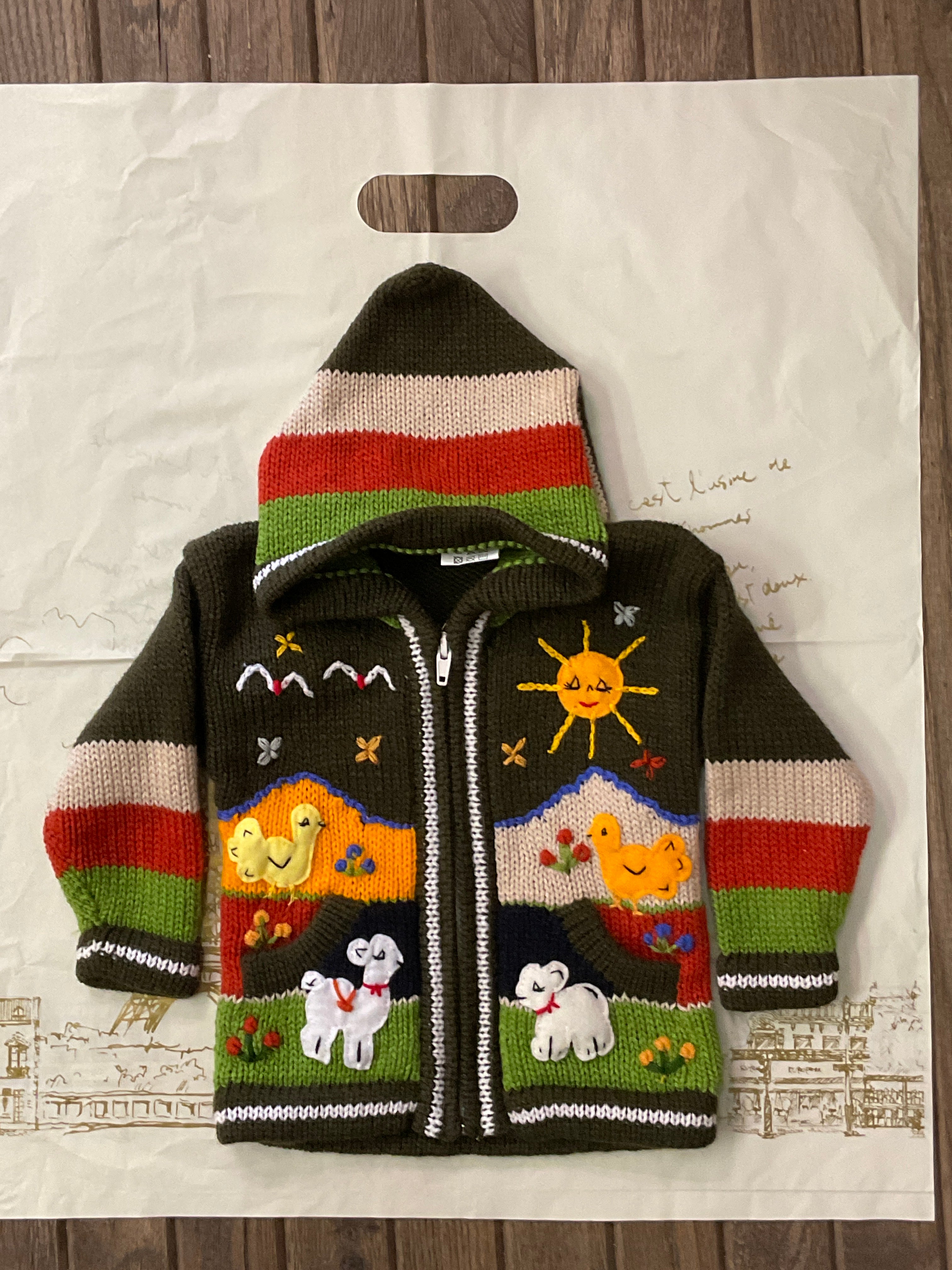 Suéter tipo cárdigan tejido a mano para niños