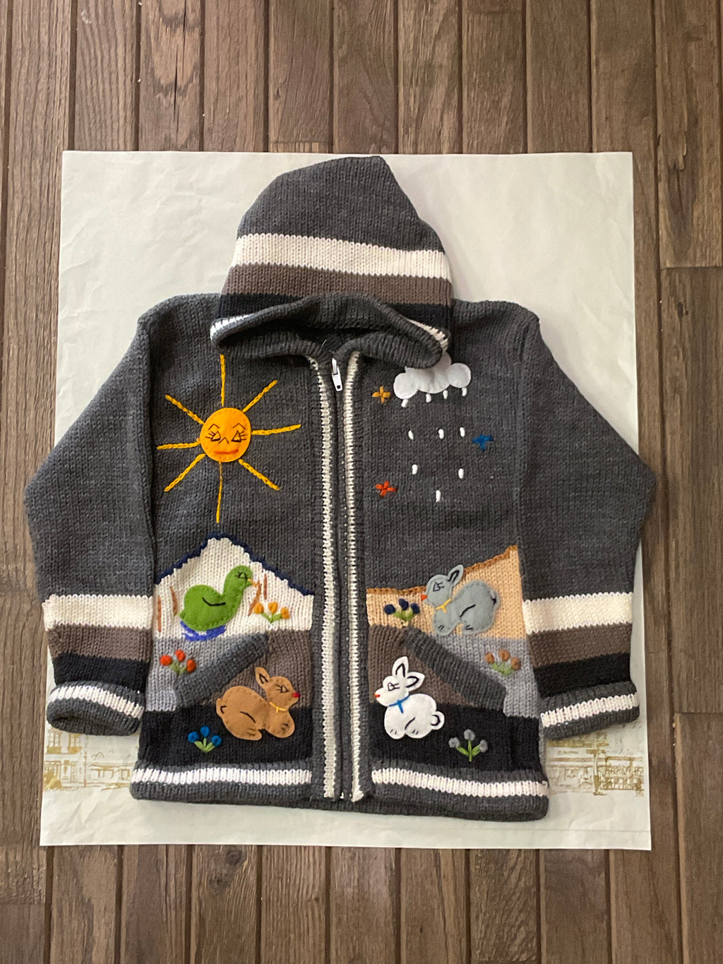 Suéter tipo cárdigan tejido a mano para niños