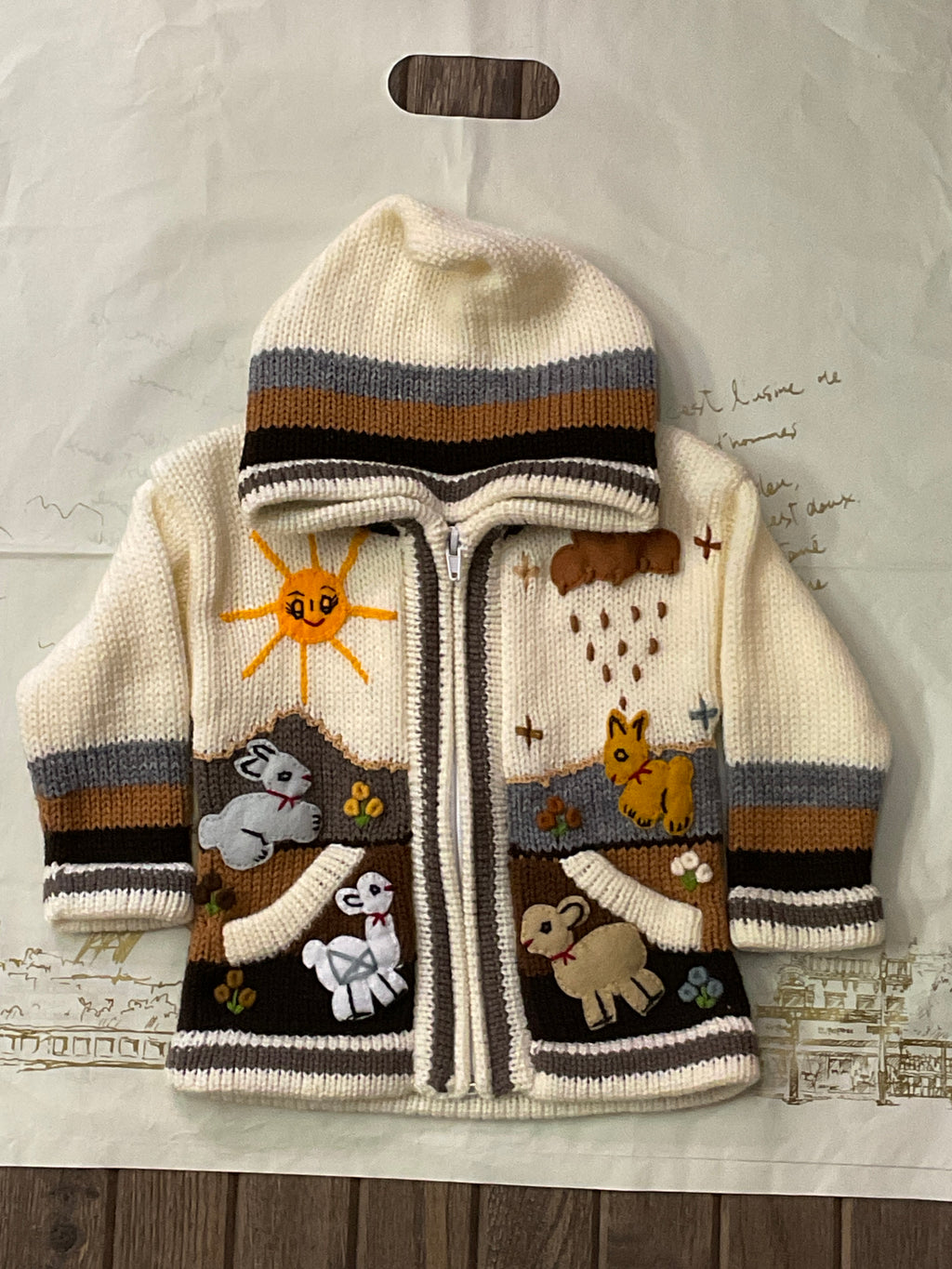 Suéter tipo cárdigan tejido a mano para niños