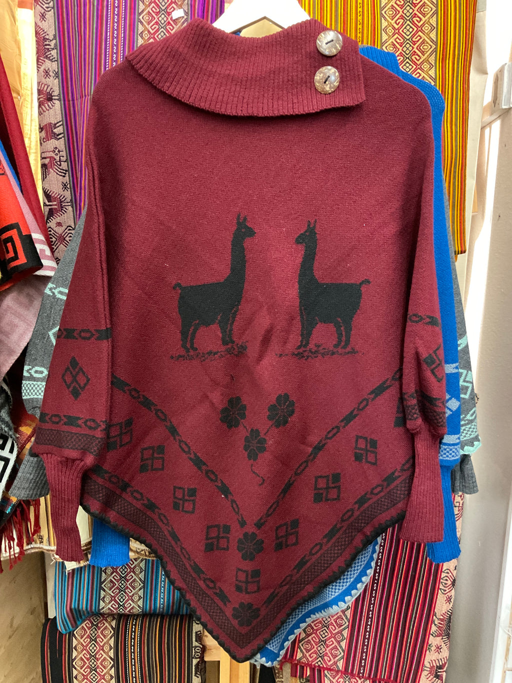 Poncho con mangas para mujer