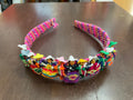 Diadema con muñecas quitapesares hechas a mano