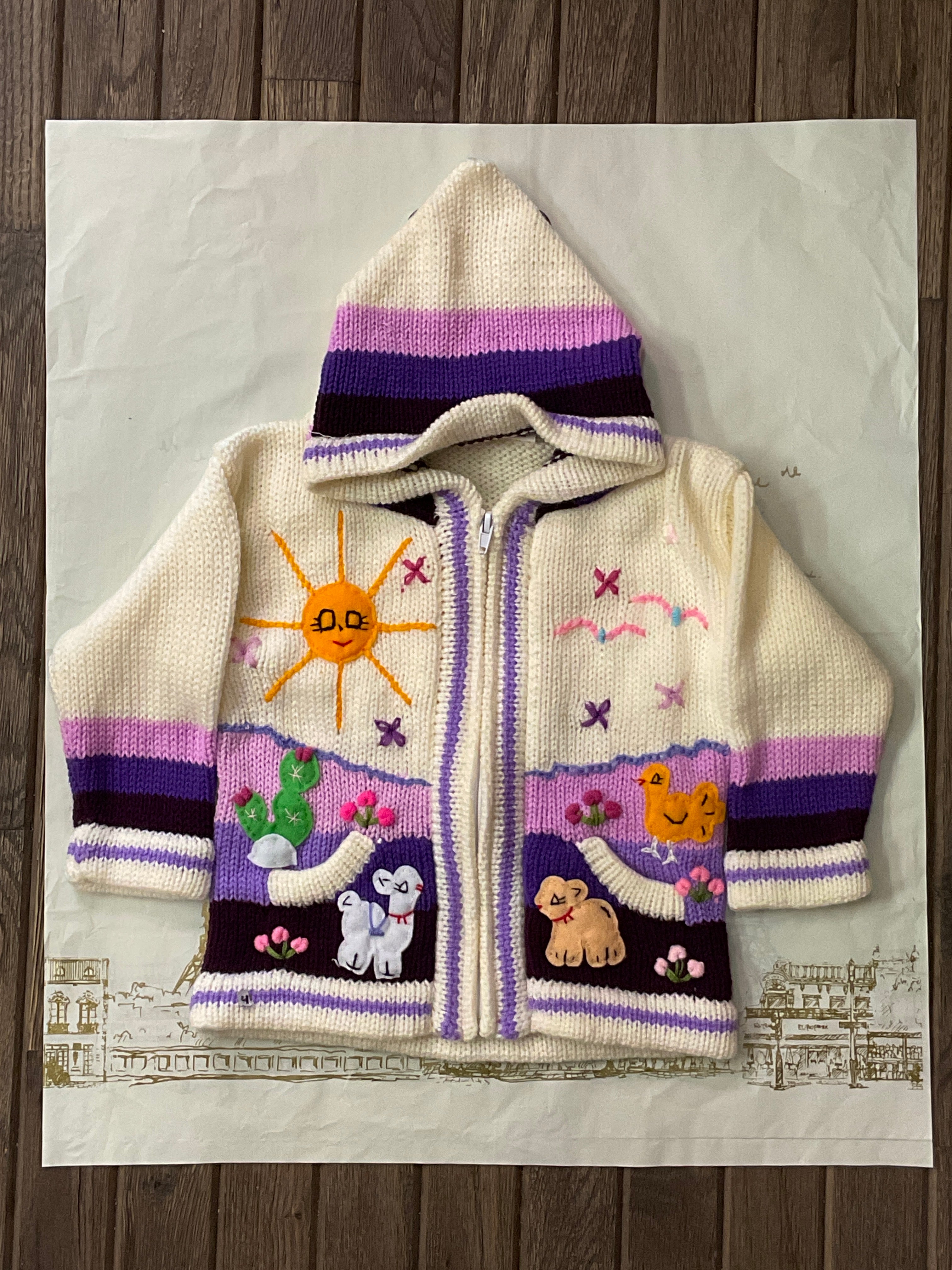 Suéter tipo cárdigan tejido a mano para niños