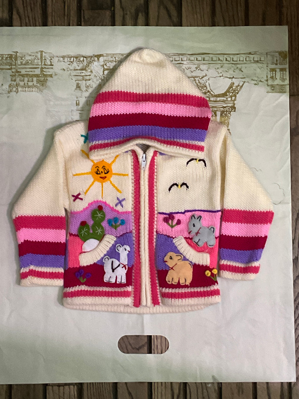 Suéter tipo cárdigan tejido a mano para niños