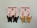 Aretes de cuerno con diseño Nazca