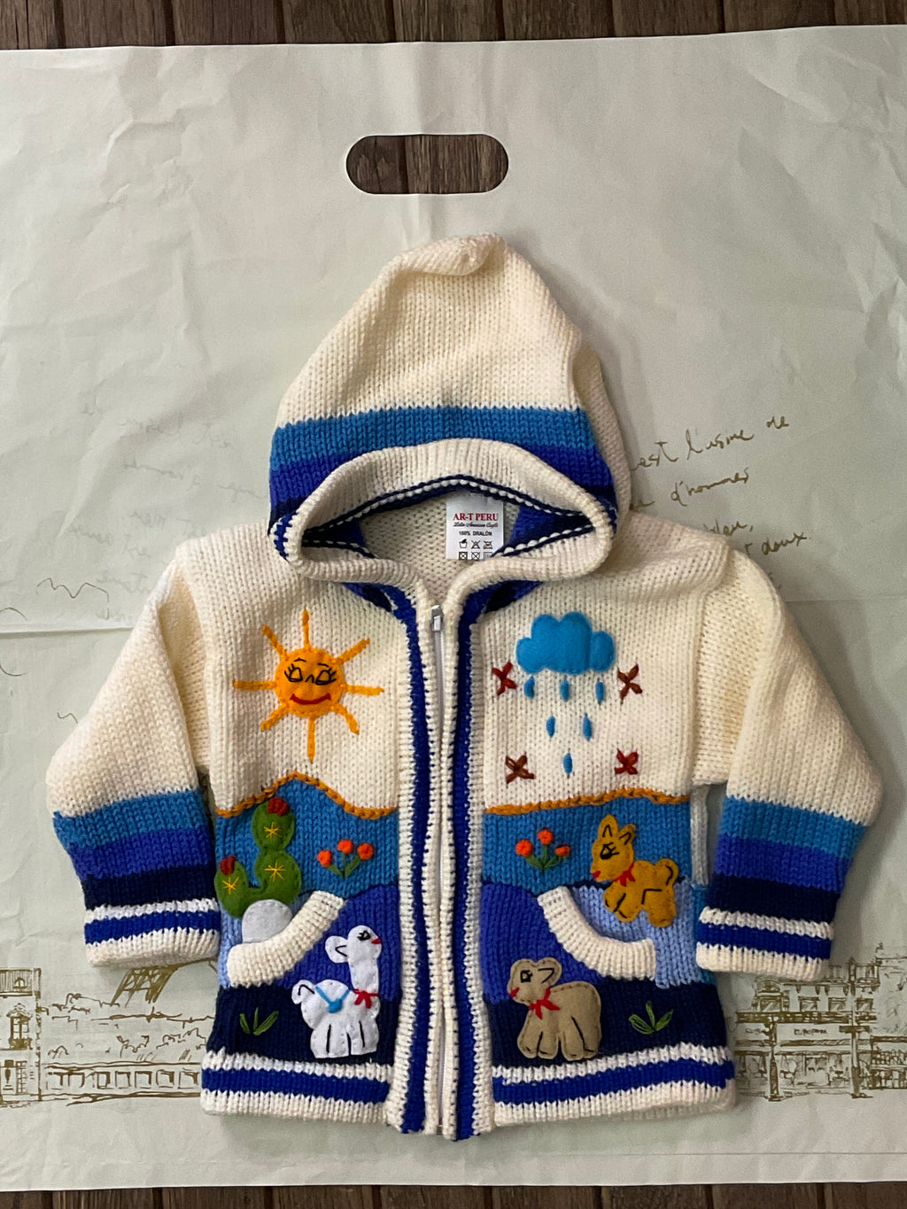 Suéter tipo cárdigan tejido a mano para niños