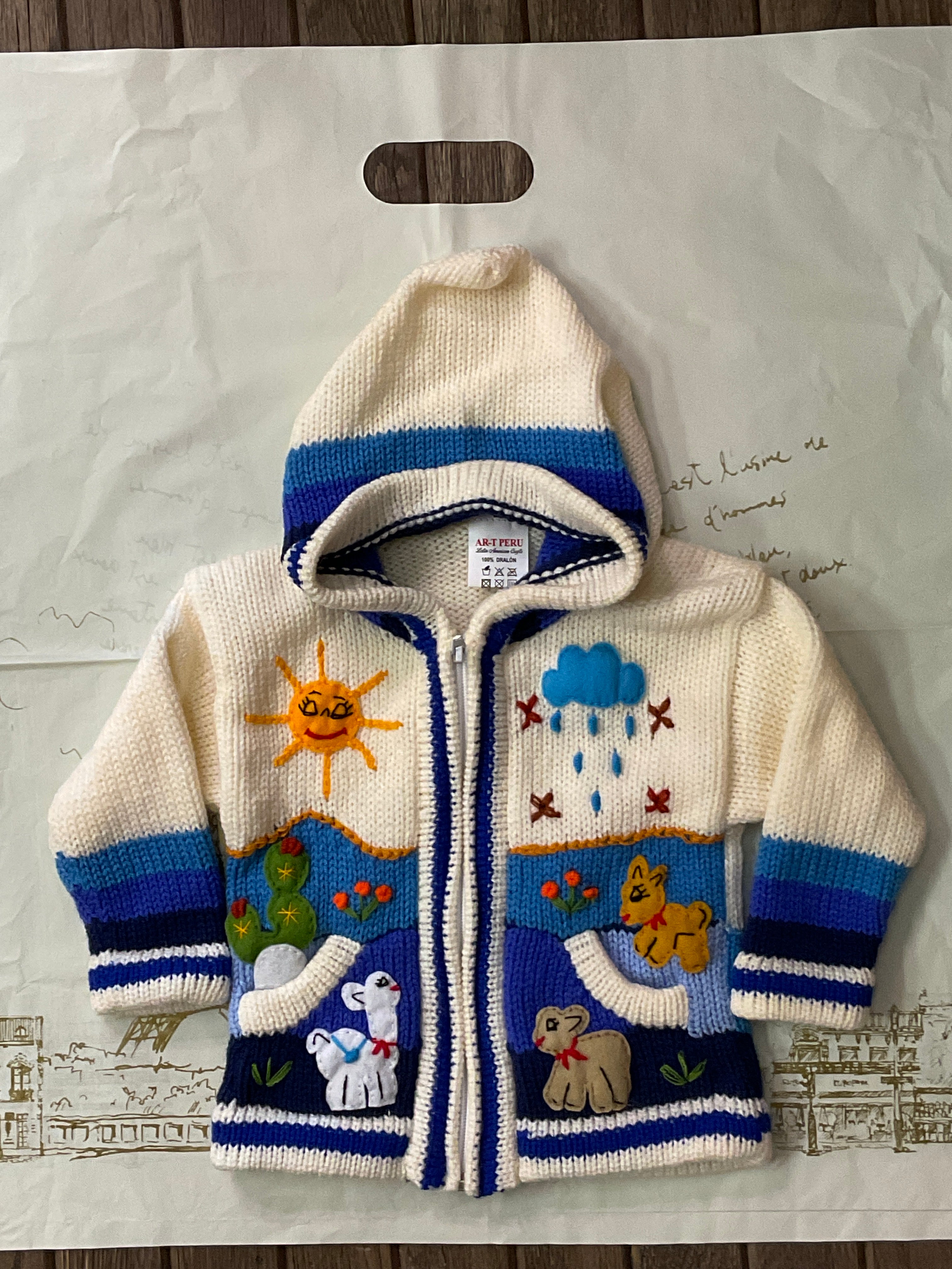 Suéter tipo cárdigan tejido a mano para niños